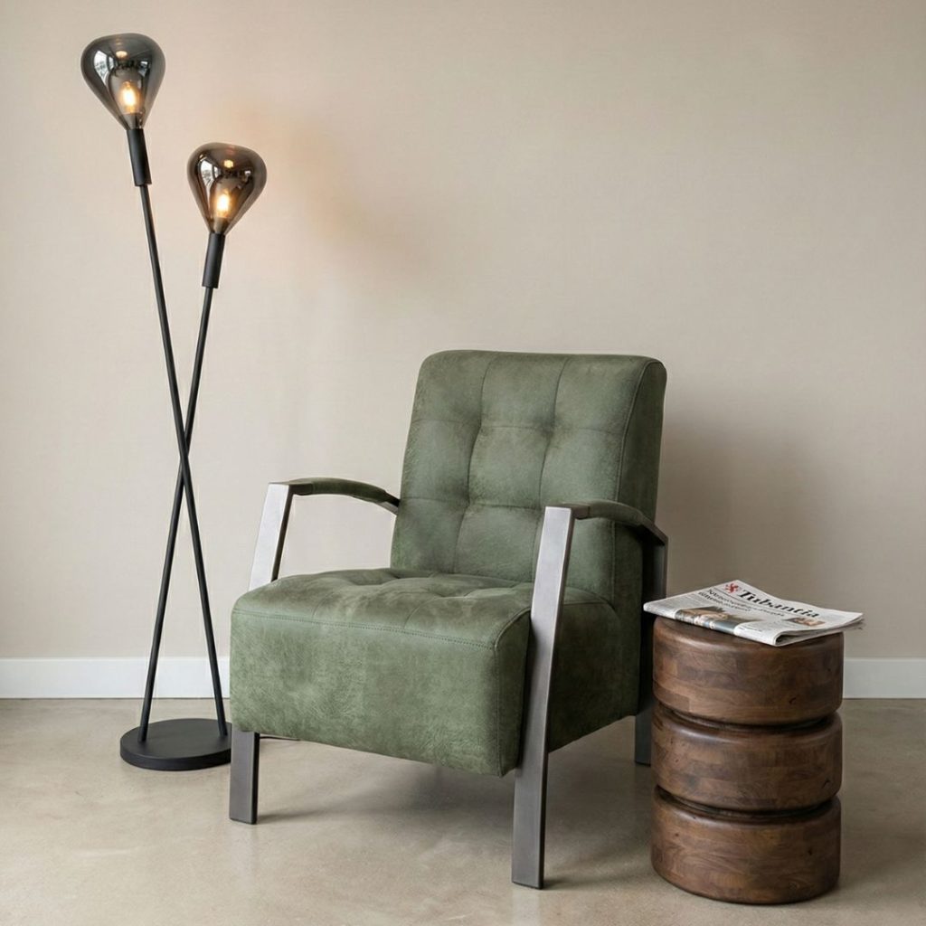 Fauteuil Thirty in groen Missouri stof met zwart metalen frame in een modern interieur