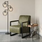 Fauteuil Ten in groen Missouri stof met zwart metalen frame in een modern interieur