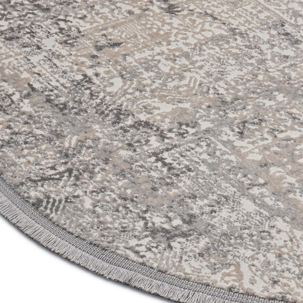 detailfoto vloerkleed beige grijs tinten en franje afwerking